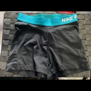Black Nike pros with blue band size Small